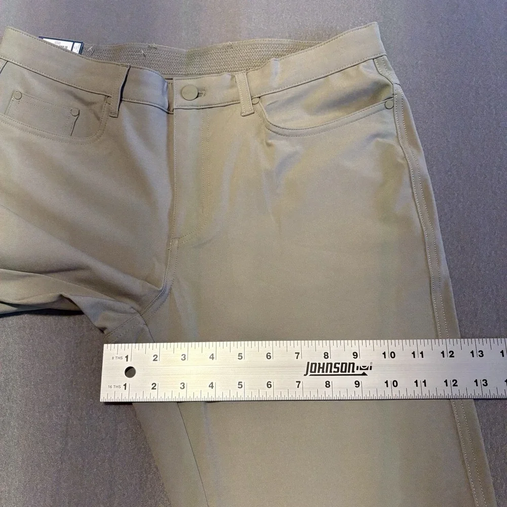 Greg Norman Tech Pants Men 32x34 Green Performance Golf Travel 4-Way Stretch NEW